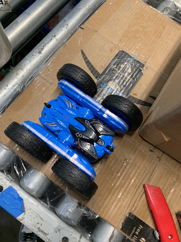 Photo 1 of (MISSING REMOTE) (UNTESTED) Terucle Remote Control Car, Rc Cars Stunt Kids Toys New Upgraded Strip Lights and Headlights Double-Sided 360° Rotating 4WD Drift Truck for Boys Girls Birthday Gift (Blue)