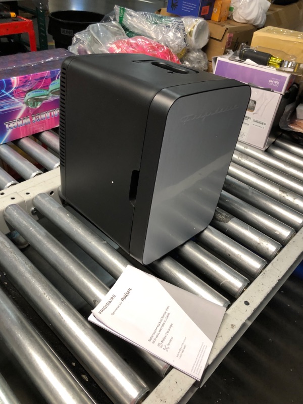 Photo 1 of ***USED - POWERS ON - UNABLE TO TEST FURTHER***
Frigidaire Portable 10L, 15-can Mini Fridge Brushed Stainless Rugged Refrigerator, EFMIS188-SS