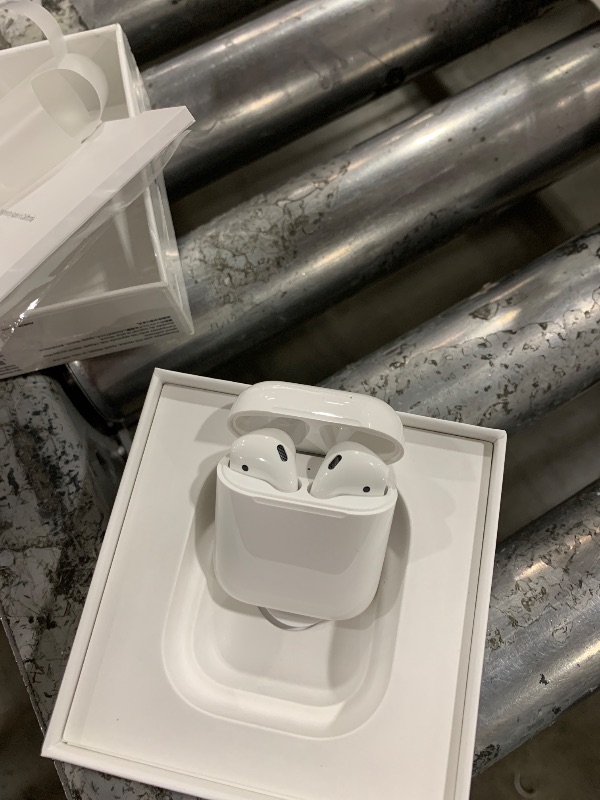 Photo 3 of Apple AirPods Wireless Ear Buds, Bluetooth Headphones with Lightning Charging Case Included, Over 24 Hours of Battery Life, Effortless Setup for iPhone