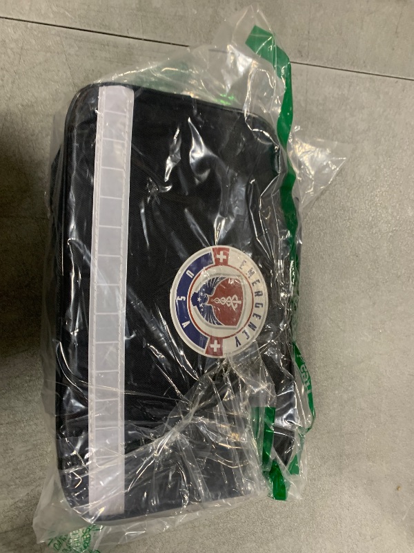 Photo 1 of Roadside Assistance Emergency Car Kit - First Aid Kit, Jumper Cables, Tow Strap, led Flash Light, Rain Coat, Tire Pressure Gauge, Safety Vest and More Ideal Winter Accessory for Your Car (Black)