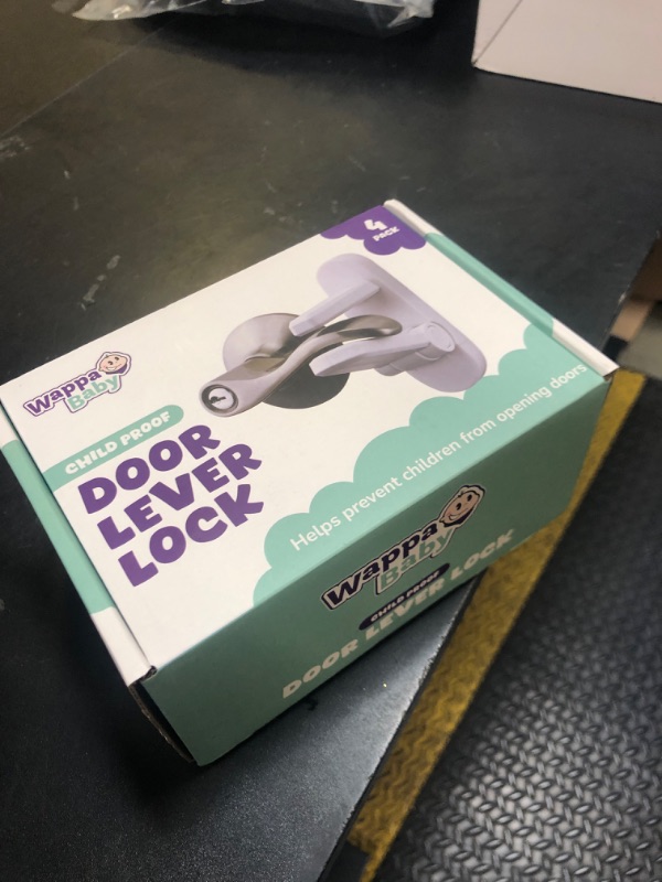 Photo 1 of Door Lever Locks (4 Pack) - Prevents Toddlers from Opening Doors - Durable ABS with 3M Adhesive - Easy One-Hand Operation for Adults, No Tools Needed