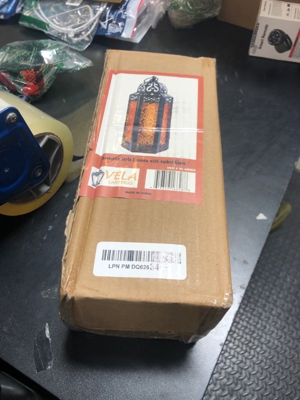 Photo 1 of VELA LANTERNS Moroccan Candle Lantern Decorative Candle Holder Lamp for Table or Hanging, Ramadan and Halloween Decorations, Outdoor Patio or Porch, Weddings, Black Metal, Amber Orange Glass, Medium