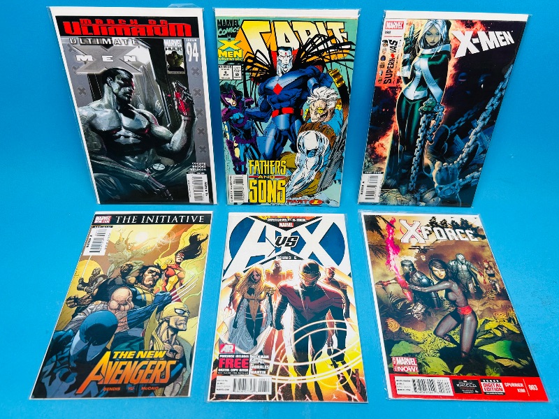 Photo 1 of 195015…6  comics in plastic sleeves 