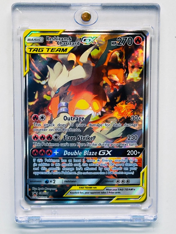 Photo 1 of 195031…Pokémon hologram Reshiram and Charizard GX black star promo card SM201 Tag Team 