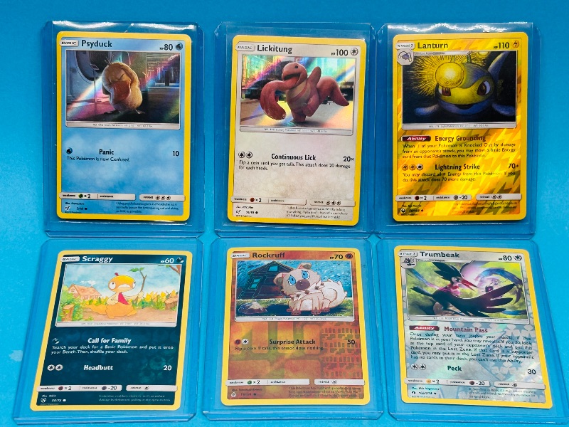 Photo 1 of 195133…6 reverse and holo Pokémon cards in hard plastic sleeves 