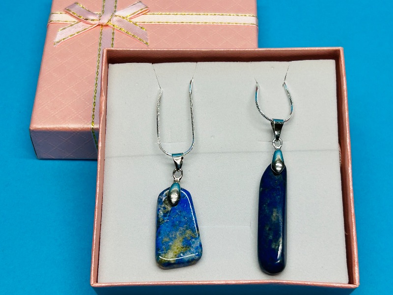 Photo 1 of 195815…2 polished rock pendants on 18” chains in gift box