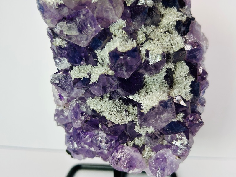 Photo 1 of 195875…7.5” amethyst crystal rock on stand- height includes stand