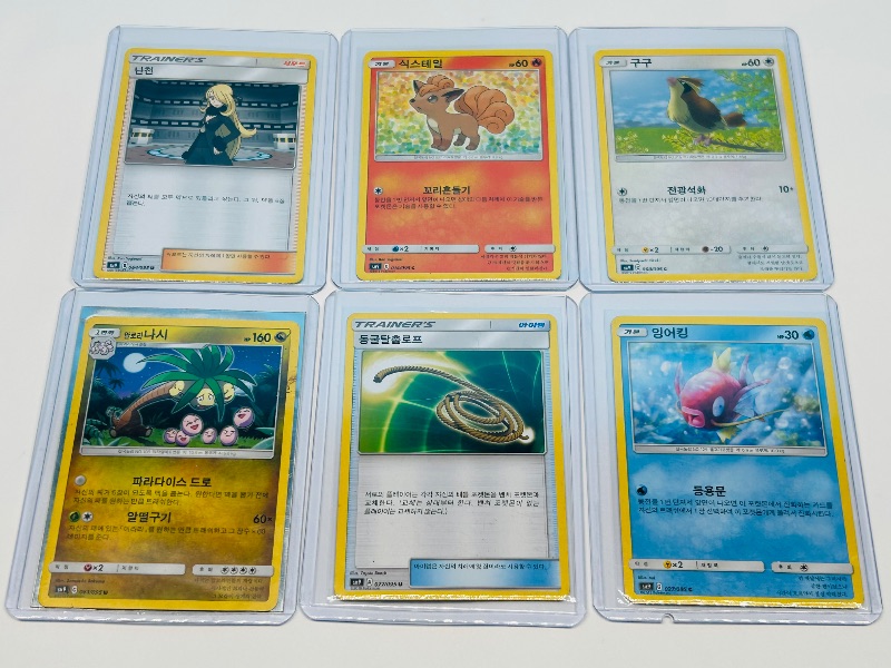 Photo 1 of 195937…Asian Pokemon cards in hard plastic sleeves