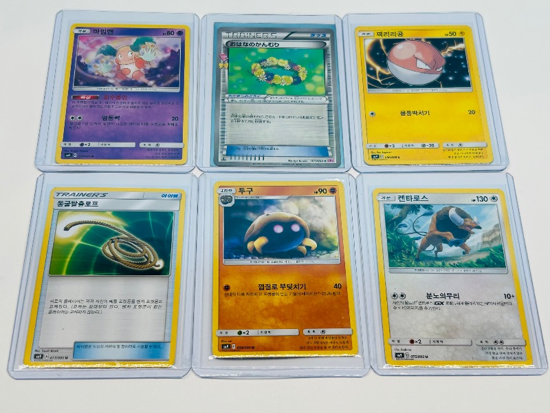 Photo 1 of 195939…. Asian Pokemon cards in hard plastic sleeves 