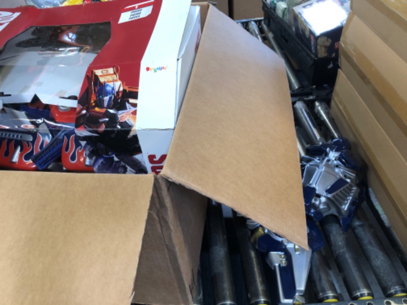 Photo 1 of Disguise Men's Hasbro Transformers Age Of Extinction Movie Optimus Prime Theatrical with Vacuform Plus 3D Costume, Blue/Red, X-Large/42-46
