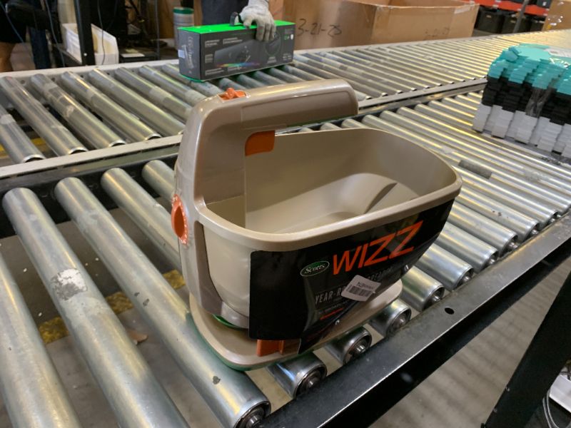 Photo 1 of Scotts Wizz Spreader for Grass Seed, Weed and Feed, Fertilizer, Salt and Ice Melt, Handheld Spreader Holds up to 2,500 sq. ft. of Product