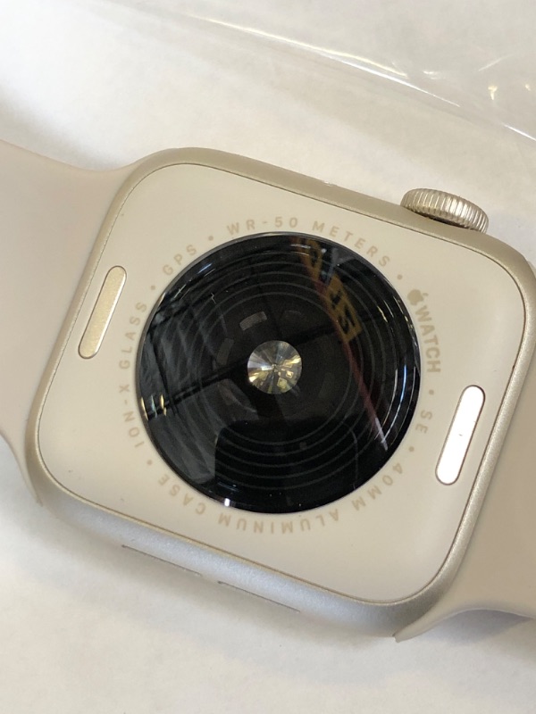 Photo 1 of Apple Watch SE (2nd Gen) (GPS, 40mm) - Starlight Aluminum Case with Starlight Sport Band, M/L (Renewed)