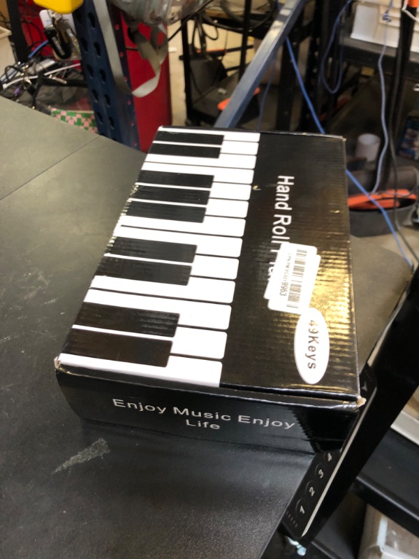 Photo 1 of Piano 49 Keys Portable Electronic Piano for Beginners, Flexible Foldable Roll Up Educational Electronic Digital Music Piano Keyboard with Recording (49keys)