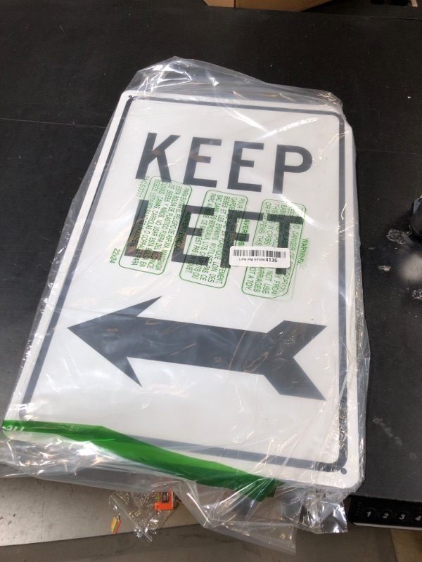 Photo 1 of NMC TM28G KEEP LEFT Sign – 12 in. x 18 in. High Intensity Reflective Aluminum Traffic Safety Sign with Black Arrow Graphic, Text on White Base