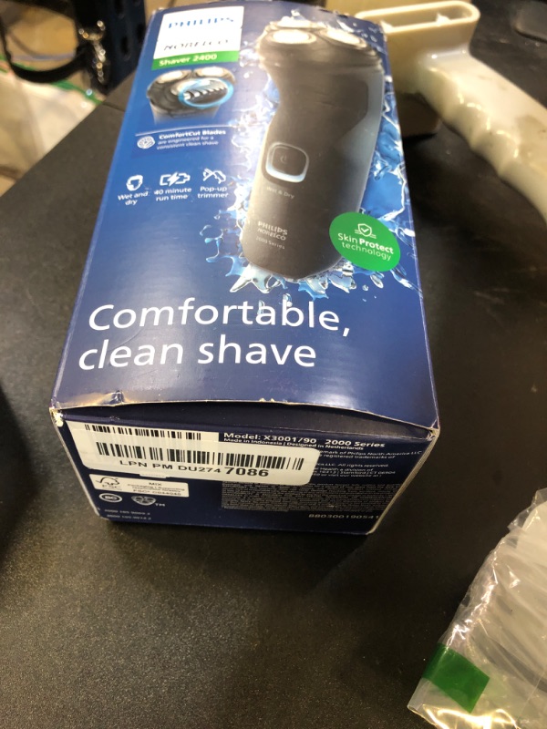 Photo 1 of Philips Norelco Shaver 2400 Series, Wet and Dry Electric Shaver, Pop-up Trimmer, P-Cap, Deep Black, Model X3001/90