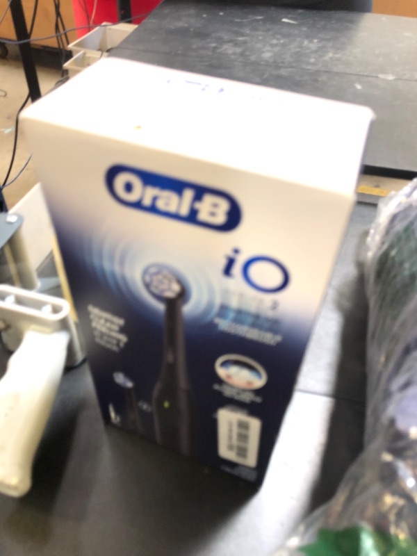 Photo 1 of Oral-B iO Series 2 Rechargeable Electric Powered Toothbrush Starter Kit, Night Black with 2 Brush Heads - Automatic Pressure Sensor to Protect Gums - 3 Modes - 2 Min Timer