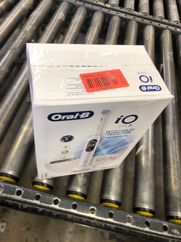 Photo 1 of Oral-B iO Deep Clean + Protect Rechargeable Electric Toothbrush, White with a iO Series 7 Toothbrush, 2 Replacement Brush Heads, and a Charging Travel Case