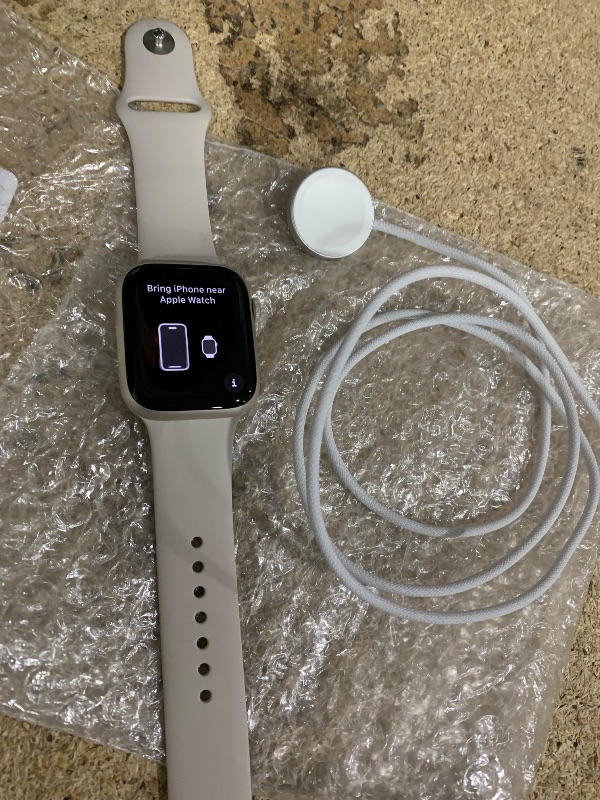Photo 1 of *NOT ON ORIGINAL PACKAGE* Apple Watch Series 9 [GPS 45mm] Smartwatch with Starlight Aluminum Case with Starlight Sport Band S/M. Fitness Tracker, ECG Apps, Always-On Retina Display, Water Resistant
