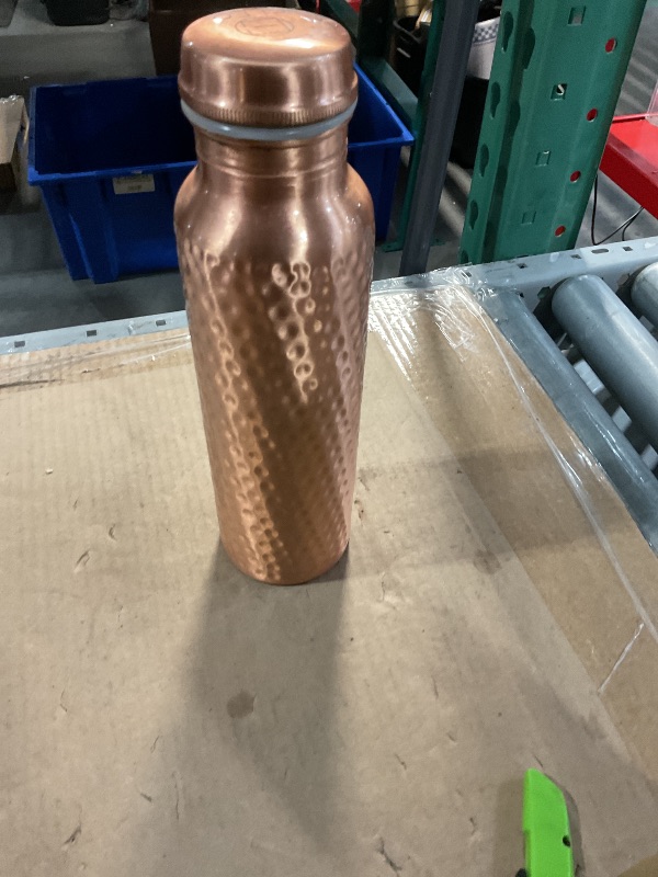 Photo 1 of ***Bottle only***

AVA DESIGNZ CLEO HOME 100% Pure Copper Water Bottle for Drinking, 32 Oz Large Hammered Ayurvedic Copper Bottle with 2 Pockets Canvas Bag & Cleaning Brush, Leak-Proof Insulated Copper Water Bottle