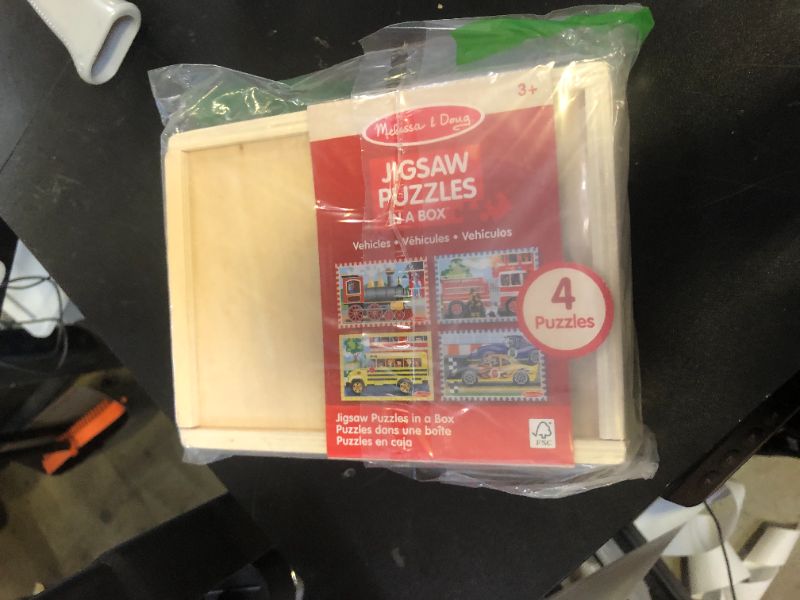 Photo 1 of Melissa & Doug Vehicles 4-in-1 Wooden Jigsaw Puzzles in a Storage Box (48 pcs) - FSC Certified