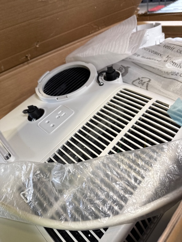 Photo 1 of Amazon Basics Portable AC (Air Conditioner) with Heat Pump, Dual Purpose (Cool and Warm), Cools 550 Square Feet, With Remote Control and Timer, 13,000 BTU ASHARE / 10000 BTU SACC, White