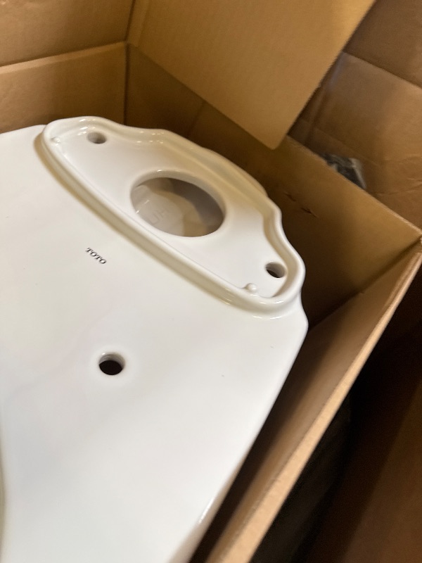 Photo 1 of TOTO Drake Transitional Two-Piece Elongated 1.28 GPF Universal Height TORNADO FLUSH Toilet with CEFIONTECT, Cotton White - CST786CEFG#01