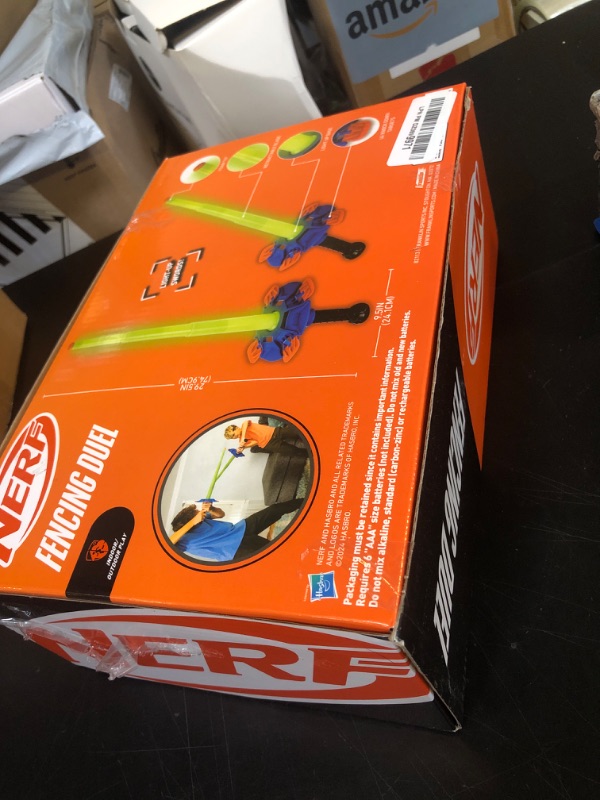 Photo 1 of Nerf Duel Swords Set - Retractable Swords with Glow in the Dark Feature - Integrated Knockdown Targets - Kids Fencing Game, Green, Blue, Orange