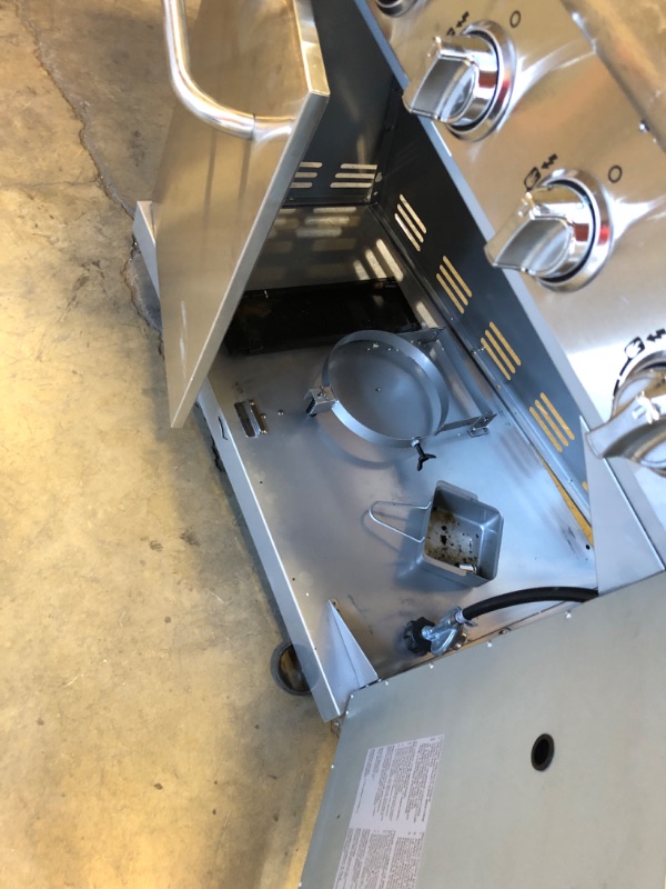 Photo 1 of Used-Major damager----Nexgrill Deluxe 6-Burner Propane Gas Grill with Ceramic Searing Side Burner, Stainless Steel Frame, Rotisserie Kit, 60,000 BTUs Output, BBQ Grill Perfect for Outdoor Gatherings - 720-0896X