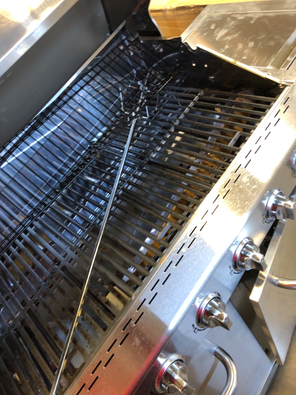 Photo 1 of Used-Major damager----Nexgrill Deluxe 6-Burner Propane Gas Grill with Ceramic Searing Side Burner, Stainless Steel Frame, Rotisserie Kit, 60,000 BTUs Output, BBQ Grill Perfect for Outdoor Gatherings - 720-0896X