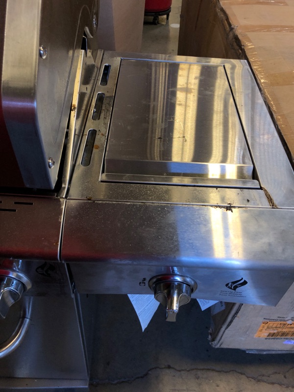 Photo 1 of Used-Major damager----Nexgrill Deluxe 6-Burner Propane Gas Grill with Ceramic Searing Side Burner, Stainless Steel Frame, Rotisserie Kit, 60,000 BTUs Output, BBQ Grill Perfect for Outdoor Gatherings - 720-0896X