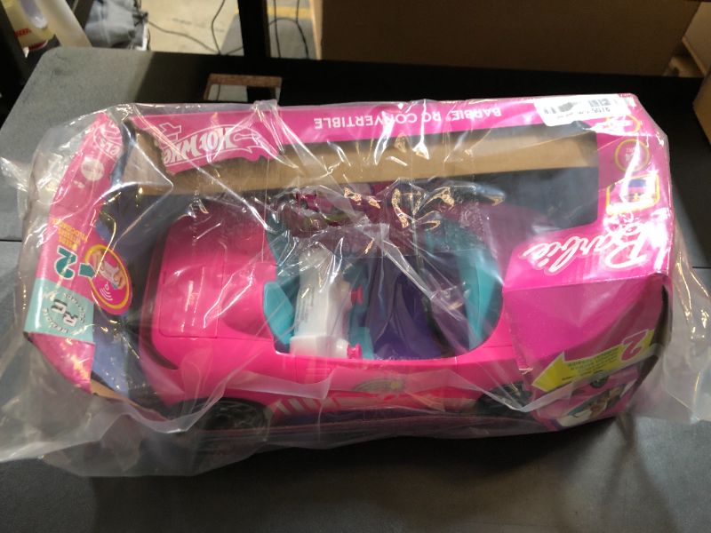 Photo 1 of Barbie Hot Wheels RC Toy Car, Remote-Control Pink Convertible, Can Hold 2 Fashion Dolls & Trunk Opens for Storage, Sticker Sheet for Customizing
