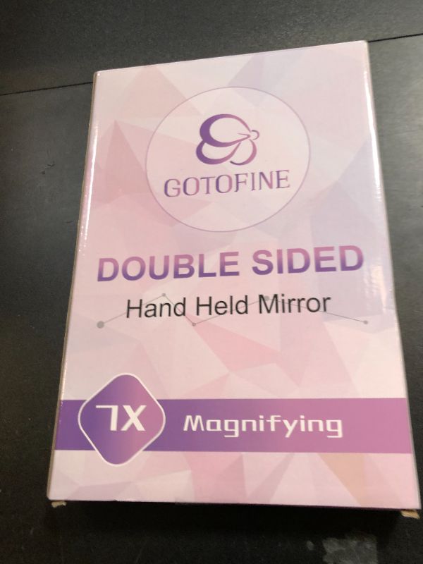 Photo 1 of Gotofine Double Sided 1x - 7X Magnification Hand Held Makeup Mirror with Adjustable Stand,Clear (7X)
