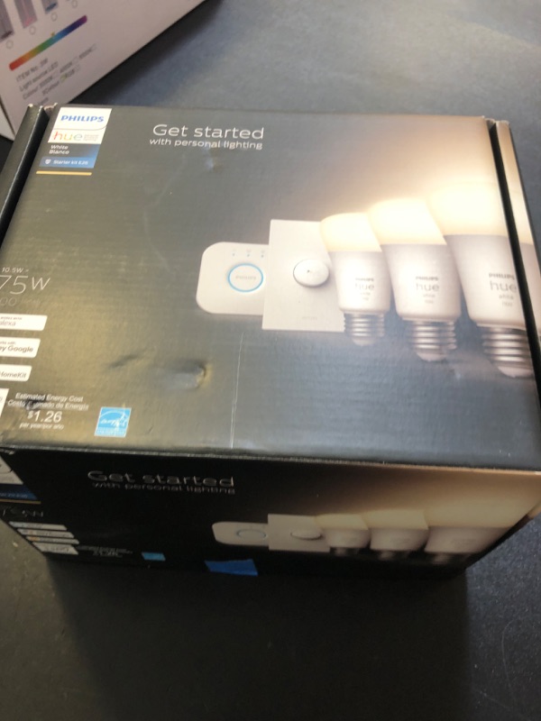 Photo 1 of Philips Hue Smart Light Starter Kit - Includes (1) Bridge, (1) Smart Button and (3) Smart 75W A19 LED Bulb, Soft Warm White Light, 1100LM, E26 - Control with Hue App or Voice Assistant