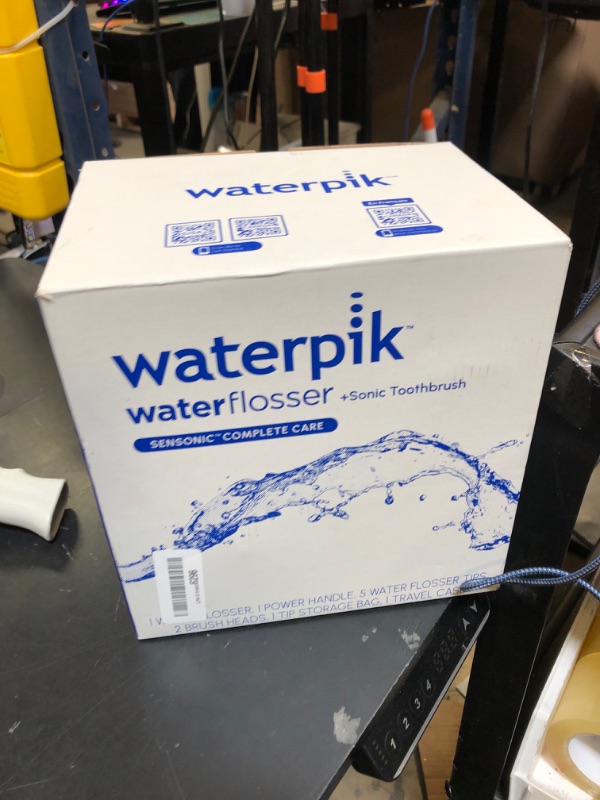 Photo 1 of Waterpik Sensonic Complete Care Water Flosser and Rechargeable Electric Toothbrush Combo Set for Teeth Cleaning and Flossing, CC-04, White, Packaging May Vary