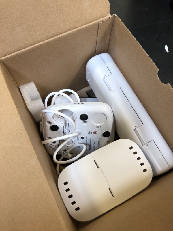 Photo 1 of Waterpik Sensonic Complete Care Water Flosser and Rechargeable Electric Toothbrush Combo Set for Teeth Cleaning and Flossing, CC-04, White, Packaging May Vary