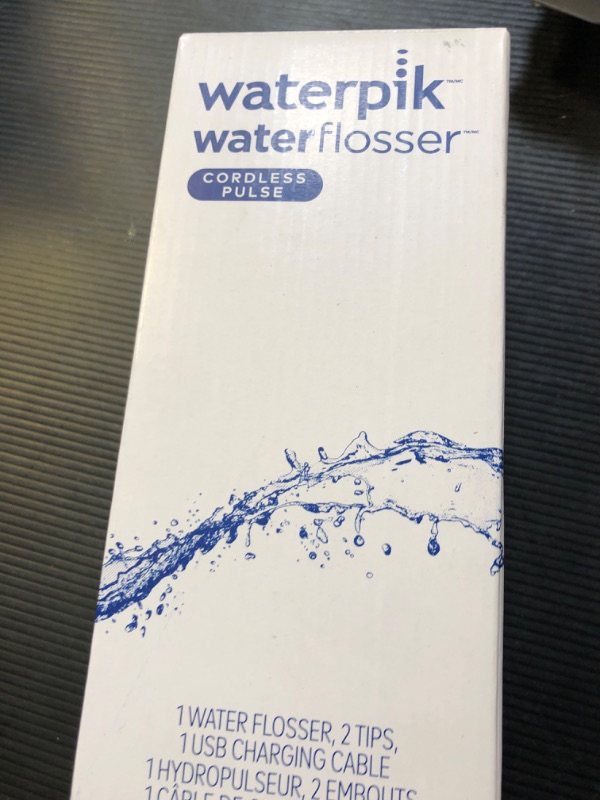 Photo 1 of Waterpik Cordless Pulse Rechargeable Portable Water Flosser for Teeth, Gums, Braces Care and Travel with 2 Flossing Tips, Waterproof, ADA Accepted, WF-20 White, Packaging May Vary