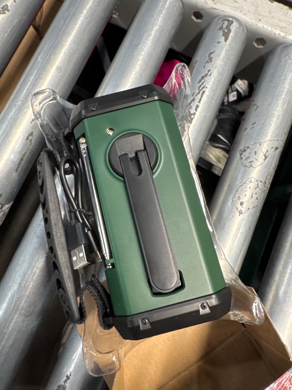 Photo 1 of (PARTIAL SET) (LIGHTS FUNCTIONAL RADIO IS NOT) QAUYYW Hand Crank Emergency Radio,37000mWhSolar Powered Hand Crank Portable NOAA AM FM Weather Radio with 3Mode Flashlight and Reading Light,Cell Phone Charger,Home and Emergency Distress Signal
