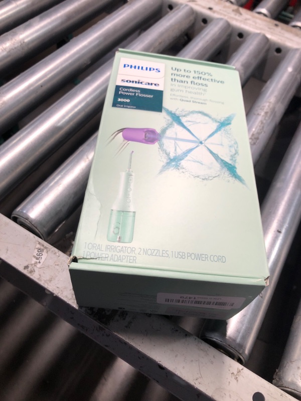 Photo 1 of Philips Sonicare Cordless Power Flosser 3000, Water Flosser with Innovative Quad Stream Technology, Oral Irrigator with 2 Flossing Modes and 3 Intensity Levels, Ergonomic Design, Mint, HX3826/24