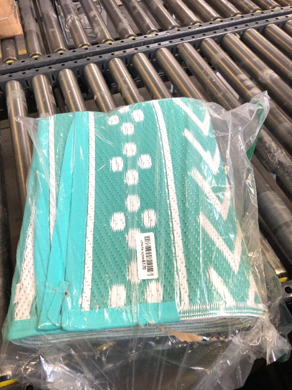 Photo 1 of Outdoor Rug Carpet Waterproof 5x8 ft Patio Rug Mat Indoor Outdoor Area Rug for RV Camping Picnic Reversible Lightweight Plastic Straw Outside Rug for Patio Decor Decoration Boho Rug Turquoise White