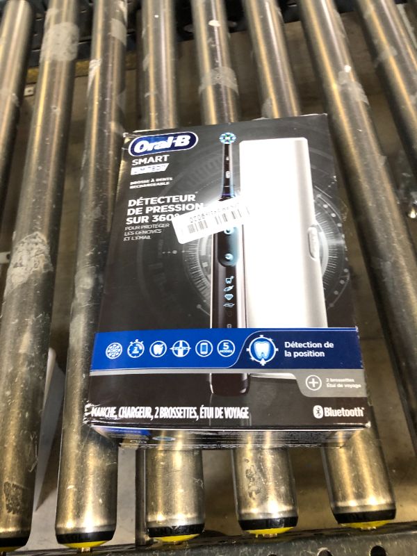 Photo 1 of Oral-B Pro Smart Limited Power Rechargeable Electric Toothbrush with (2) Brush Heads and Travel Case, Black
