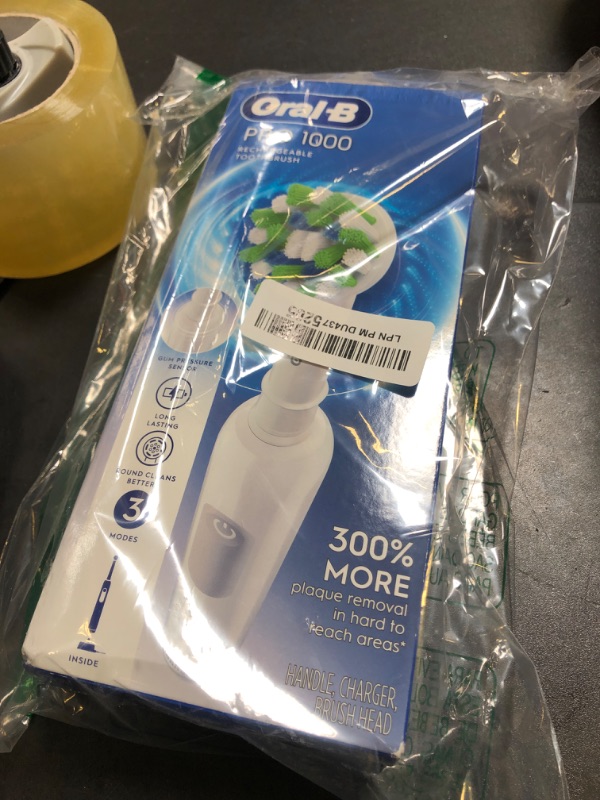 Photo 1 of Oral-B Pro 1000 Rechargeable Electric Toothbrush, White