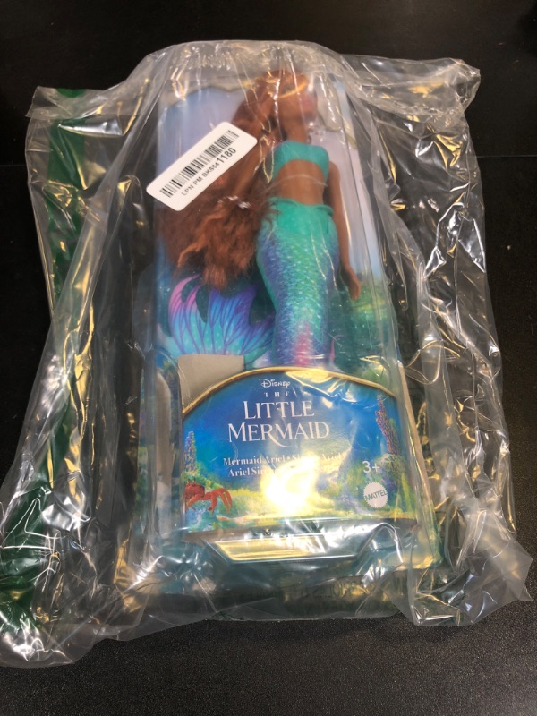 Photo 1 of Mattel Disney Toys, Ariel Fashion Doll with Signature Outfit, Inspired by Disney’s The Little Mermaid Movie