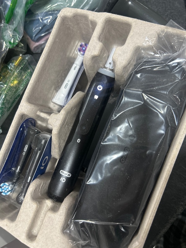 Photo 1 of Oral-B iO Deep Clean + Whiten Rechargeable Electric Toothbrush with Visible Pressure Sensor, 2 Minute Timer, 5 Cleaning Settings, 1 iO5 Limited, 3 Toothbrush Heads, Travel Case & Refill Holder, Black