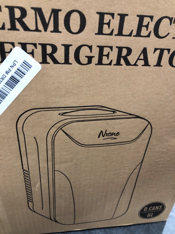 Photo 1 of NXONE White Mini Fridge,8 Can/6 Liter Small Refrigerator,110VAC/ 12V DC Portable Thermoelectric Cooler and Warmer Freezer Skincare Desk Little Tiny fridge for Cosmetics,Foods, Bedroom,Dorm,Office,Car