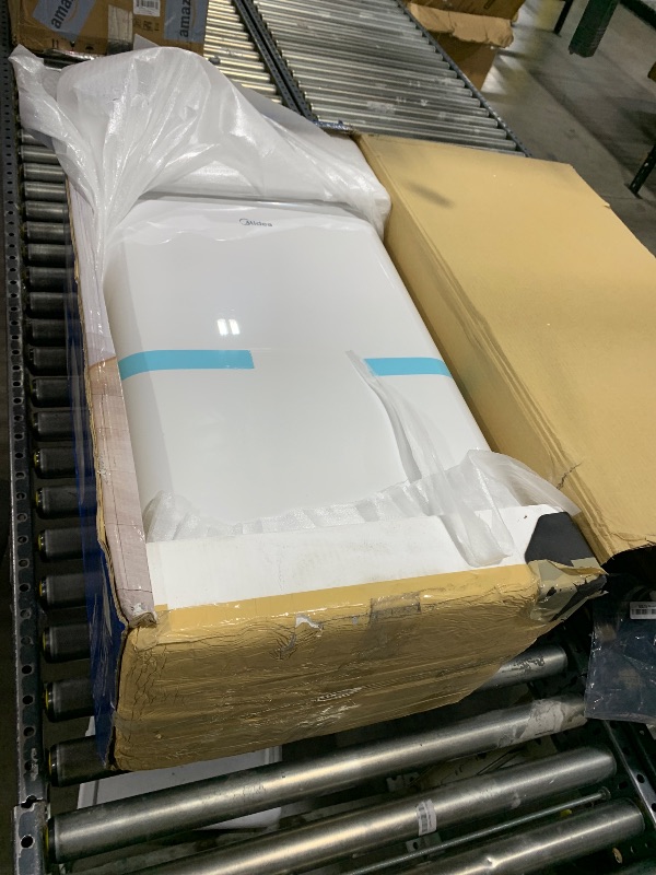 Photo 1 of Midea 14,000 BTU ASHRAE (10,000 BTU SACC) Portable Air Conditioner, Cools up to 450 Sq.Ft., with Dehumidifier & Fan mode