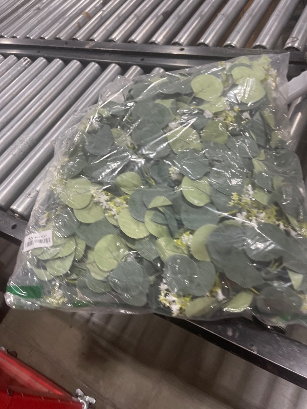 Photo 1 of KHOYIME Eucalyptus Garland with White Flowers, 4 Packs 5.9Ft Artificial Silver Dollar Eucalyptus Leaves Plant Fake Greenery Hanging Ivy Vines Faux Wreath for Wedding Arch Party Mantle Table Home Decor