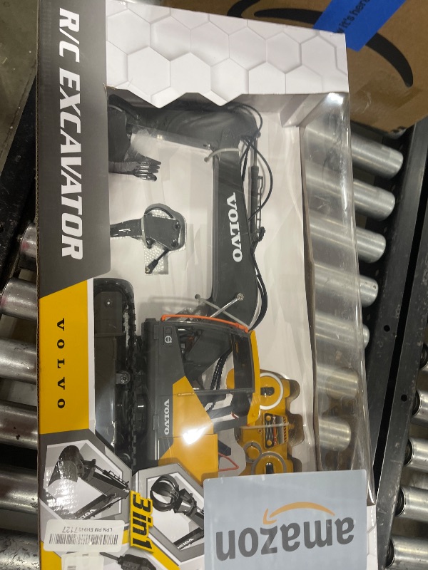 Photo 1 of DOUBLE E Volvo RC Excavator 17 Channel 3 in 1 Construction Toys, 17 Channel Remote Control Vehicles Tractor Sandbox Toys Digger with Metal Shovel Drill Grab RC Truck for Kids Adults