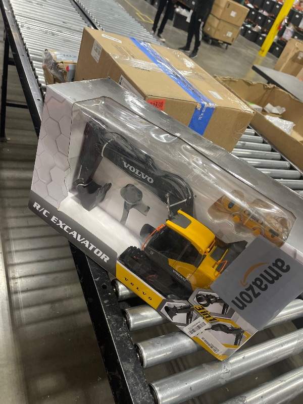 Photo 1 of DOUBLE E Volvo RC Excavator 17 Channel 3 in 1 Construction Toys, 17 Channel Remote Control Vehicles Tractor Sandbox Toys Digger with Metal Shovel Drill Grab RC Truck for Kids Adults