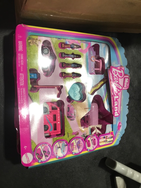 Photo 1 of Barbie Mini BarbieLand 4-Pack Doll & Toy Vehicle Set with 4 1 1/2-inch Dolls & 4 Iconic Toy Vehicles with Color-Change Surprise