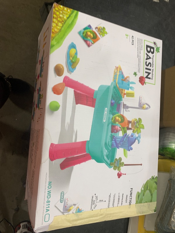 Photo 1 of Kitchen Play Sink Toys with Running Water for Kid 4-8,4-in-1 Electric Water Table for Toddlers 1-3 with Water Pump,Animals, Food, Tableware,Color Changing Pretend Role Birthday Toy for Boy and Girl